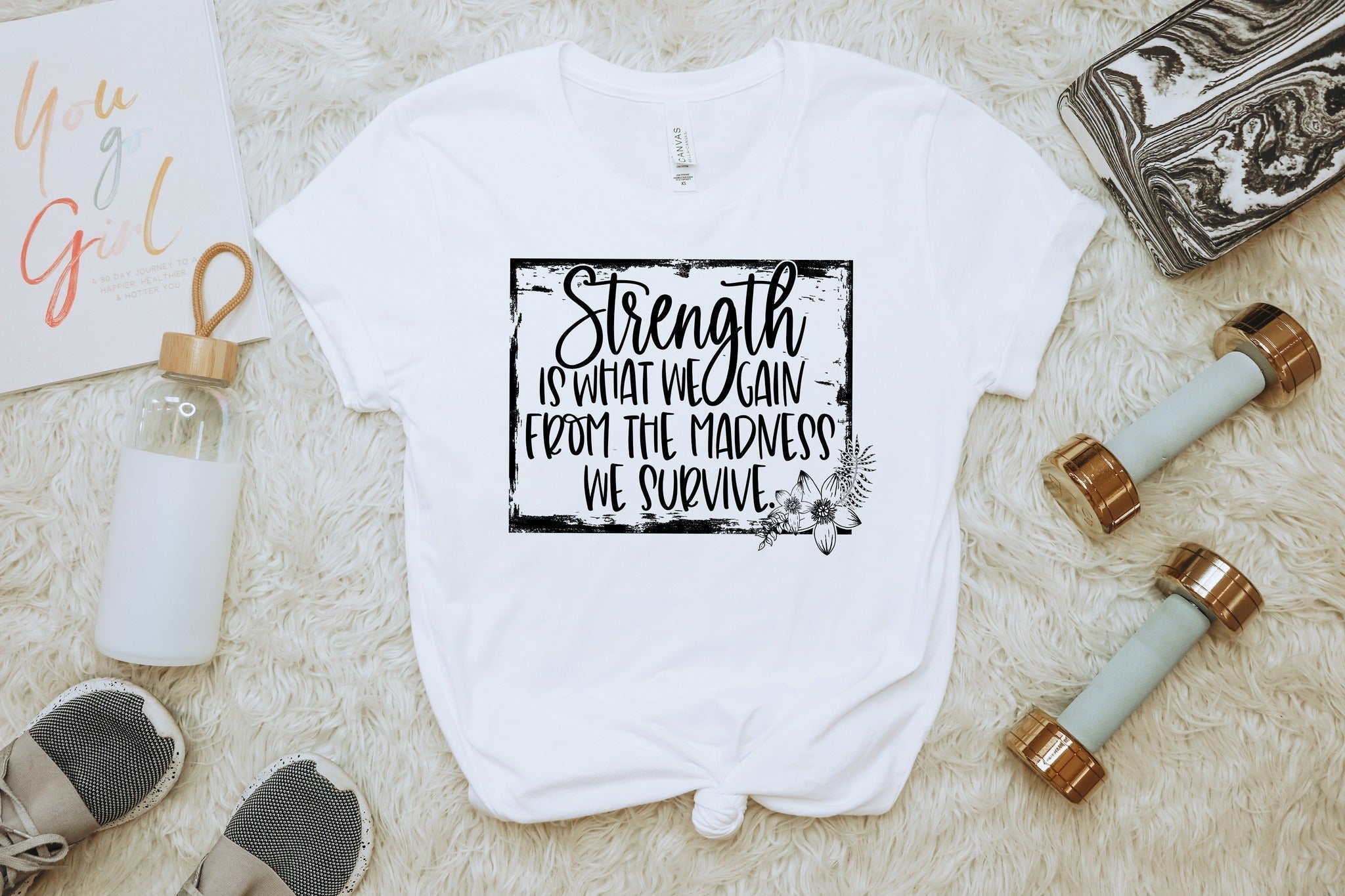 Strength Is What We Gain” Motivational Quote T-Shirt – Uplifting Graphic Tee for Women